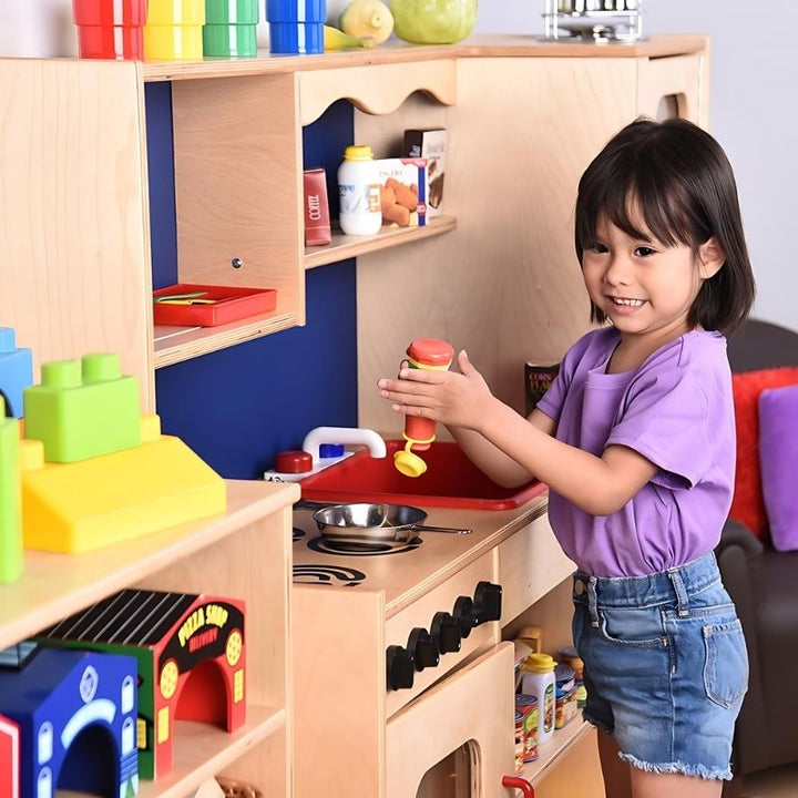 Constructive Playthings Five In One Kitchen - Child Close Up View Play
