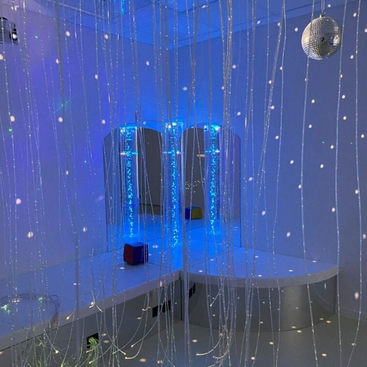 TFH Bubble Tube Corner Seat Base - 1 Hole - Room corner view in blue light with firer optic