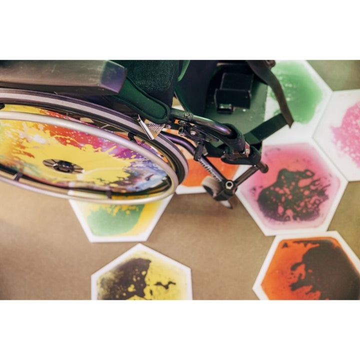 TFH Hexagon Liquid Floor Tiles - 9 Set - Top view wheelchair on liquid tiles