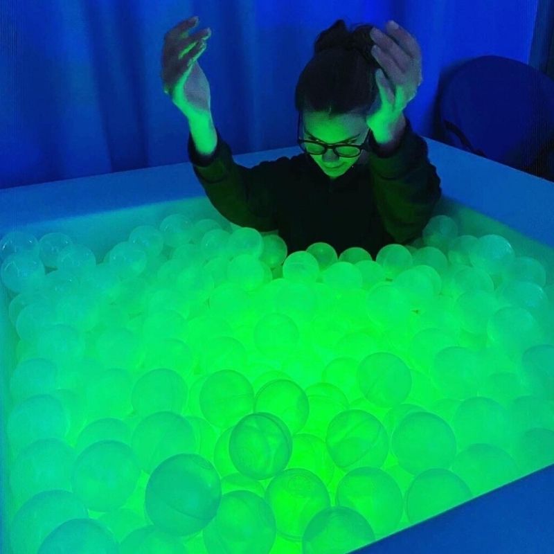 TFH Large Light-Up Ball Pit - w/ 3000 Balls  - Girl active play inside the pit with green light and blue light background