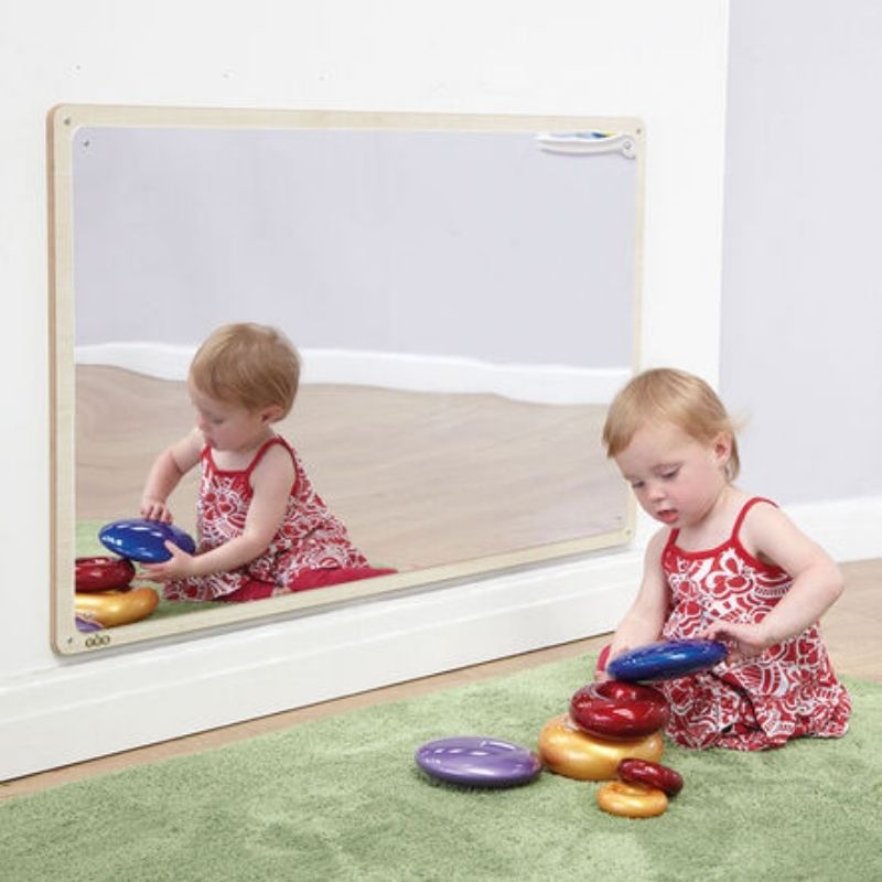 TTSWoodenFramedToddlerMirror-106x66cm-active_girl_playing_while_sitting_in_front_of_mirror