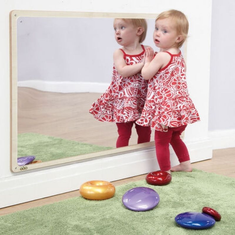 TTSWoodenFramedToddlerMirror-106x66cm_1-active girl standing in front of mirror