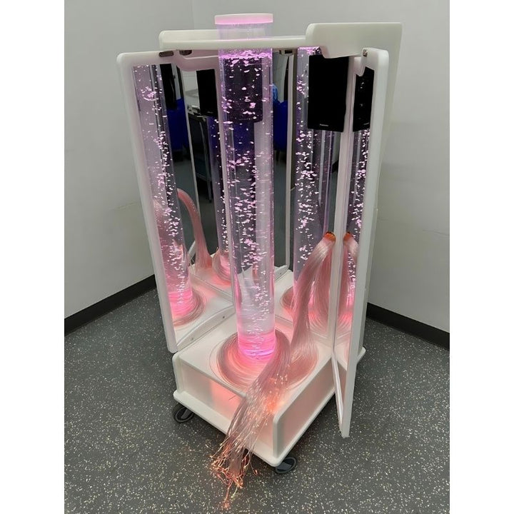 AHS Relaxation Mirrored Bubble Rover shown with pink light in a dark room, a portable medical grade sensory room for clinics and hospitals