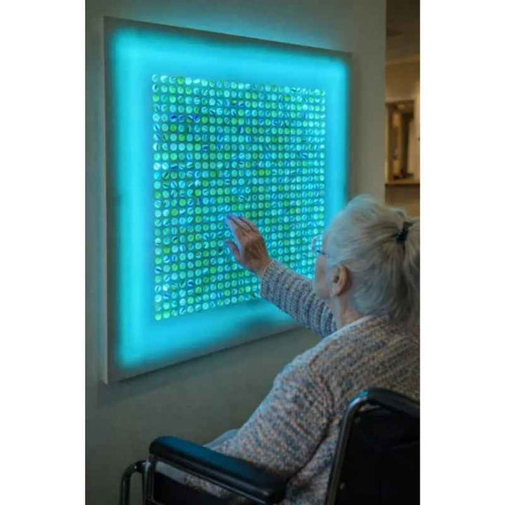 Close-up of the AHS Marvelous Sensory Marble Wall Panel steel grid showing iridescent marbles for tactile and visual sensory exploration