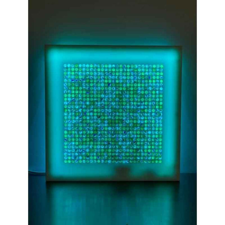 AHS Marvelous Sensory Marble Wall Panel fully lit with LED lighting, displaying the complete 30 x 30 inch iridescent marble grid for sensory room and therapy room installation