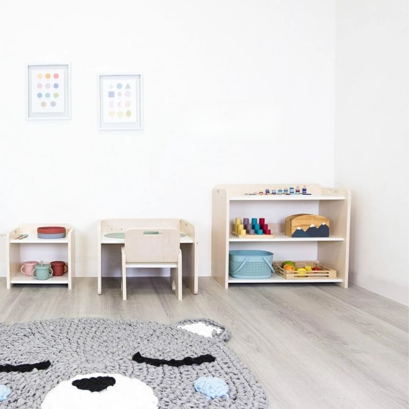 Sapiens Child Banana Montessori Shelf with Borders landscape view in an indoor home environment, showing the compact 28.6 inch wide child-sized shelf in a nursery or playroom setting