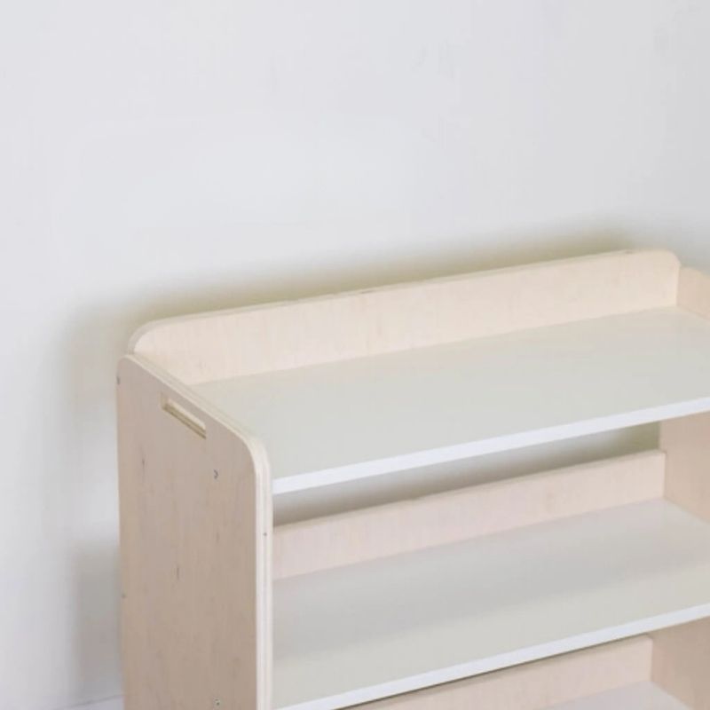 Banana Montessori Shelf with Borders close-up top view showing the raised border construction that prevents Montessori materials and toys from falling off the sides and back of the shelf
