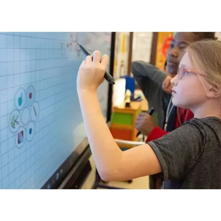 Child writing on the Boxlight MimioPro G 4K interactive display, showing the high-precision infrared touch and palm rejection technology for student interaction in a classroom setting