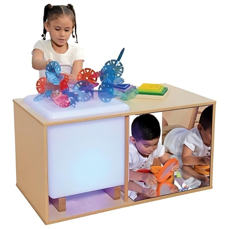 Two children actively exploring the Constructive Playthings Ultimate Light Studio, showing collaborative sensory light and mirror play in a classroom or therapy setting