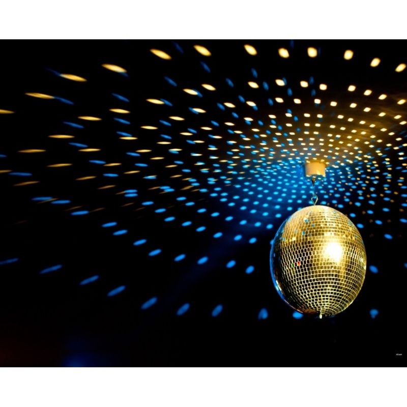 Experia Deluxe Mirror Ball Bundle landscape view with warm golden LED pinspot light, showing the spinning colour reflections across the room created by this sensory light bundle