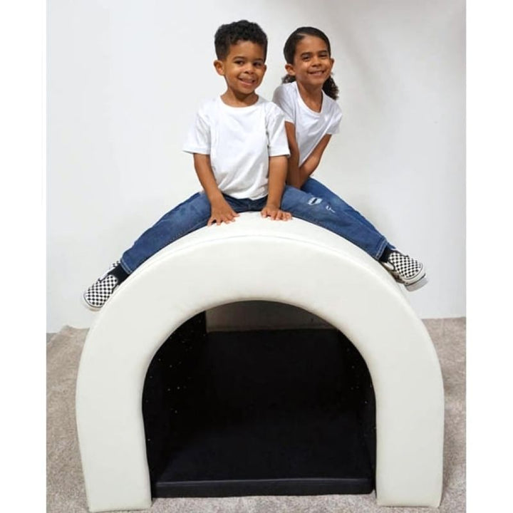 Two children climbing on top of the Experia Fibre Optic Tranquility Tunnel demonstrating its incredibly sturdy phthalate-free vinyl construction