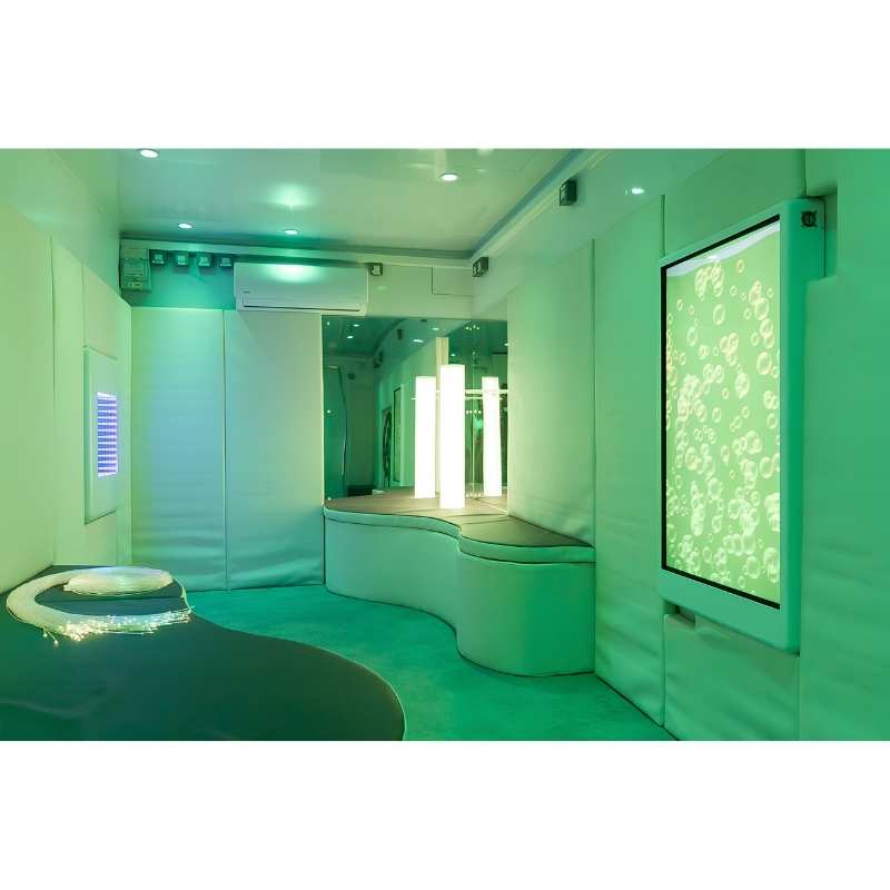 Landscape view of the Experia Intelli Panel Bubble Wall interactive sensory wall panel in green light