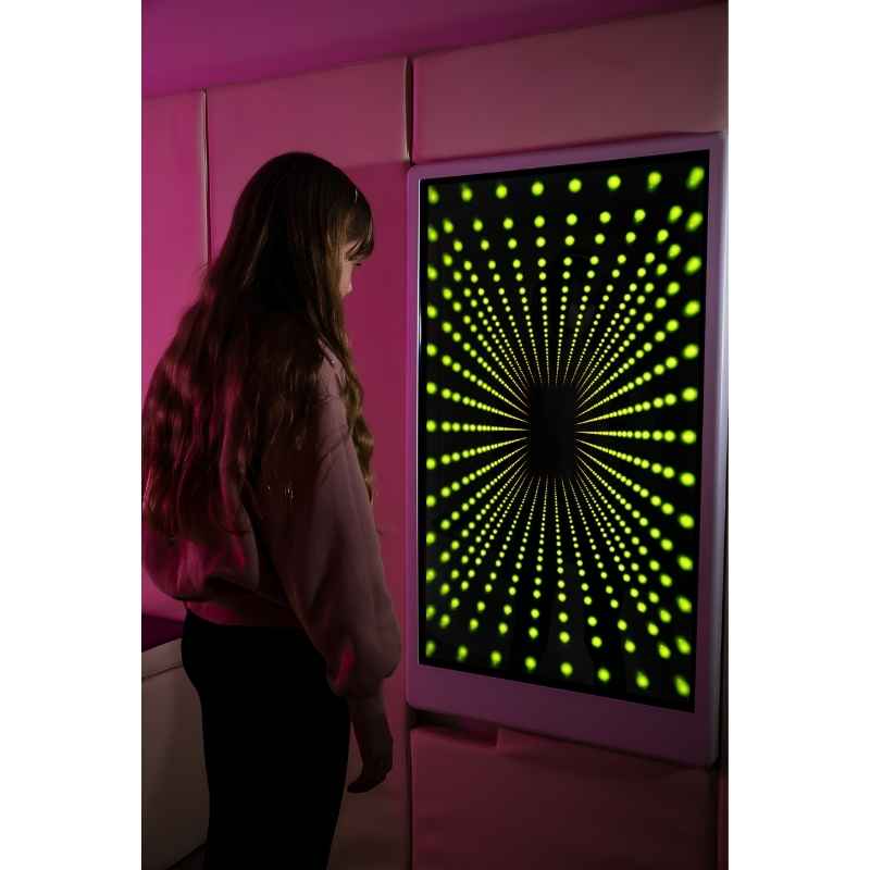 Teen engaging with the Experia Intelli Panel Infinity sensory wall panel displaying yellow light effects