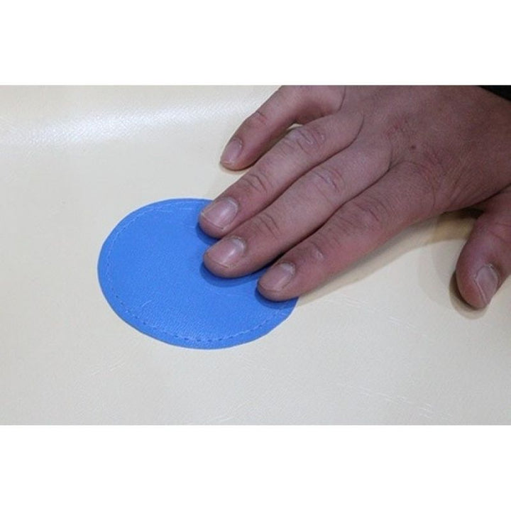 Close-up of a hand pressing a colour switch on the soft wall of the Experia Interactive LED Ball Pool, demonstrating the on-wall colour control that changes all translucent balls in the pool