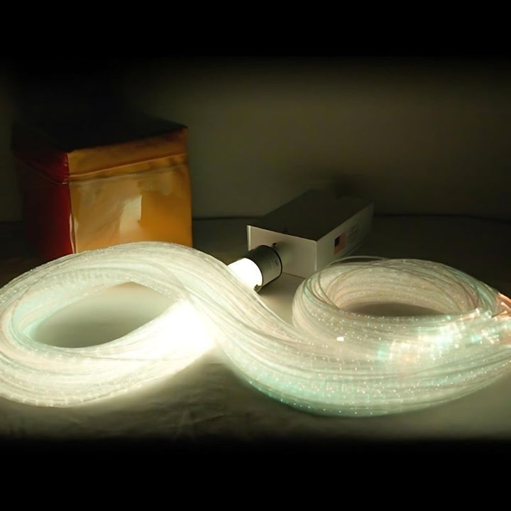 Close-up of the Experia IRiS LED Fibre Optic Bundle with Qube in cool white light showing the complete fibre optic strand display of the portable lap-safe IRiS bundle