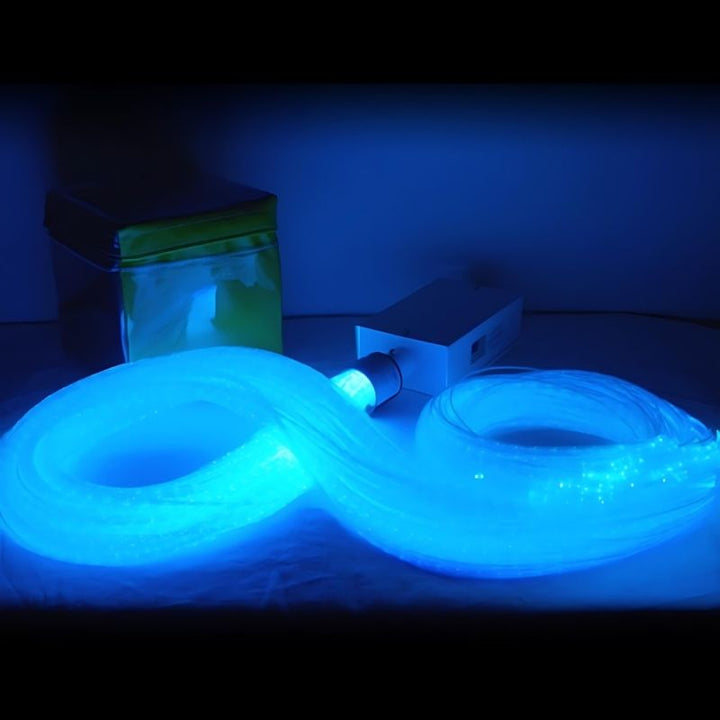 Close-up of the Experia IRiS LED Fibre Optic Bundle with Qube in cyan light showing the range of IRiS colour-changing effects across the portable 12-pound fibre optic bundle