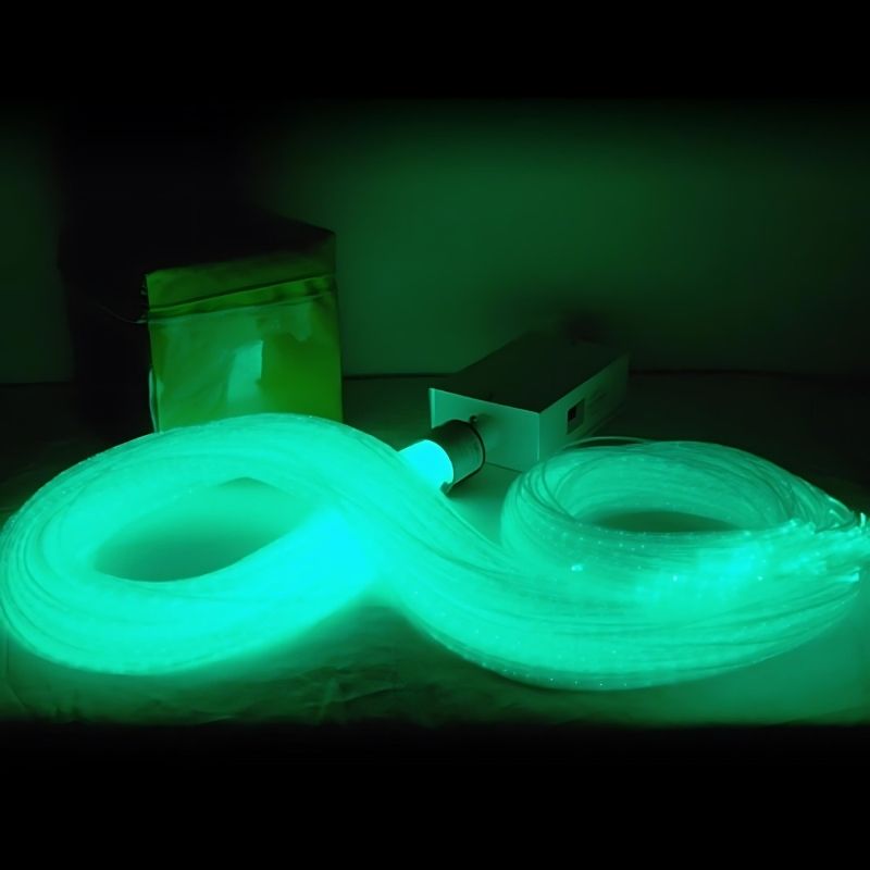 Close-up of the Experia IRiS LED Fibre Optic Bundle with Qube in green light demonstrating the 8-colour wireless roll-to-change IRiS Qube interaction with the LED fibre optic strands