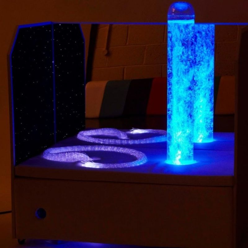 Experia Portable Sensory Corner Calming with blue LED bubble tube and purple fibre optics active, illustrating the calming visual effect of the self-cycling colour sequence