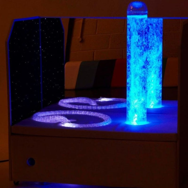 Experia Portable Sensory Corner Calming with blue LED bubble tube and purple fibre optics active, illustrating the calming visual effect of the self-cycling colour sequence