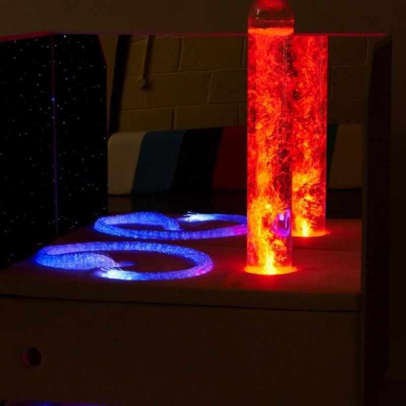 Experia Portable Sensory Corner Calming showing red bubble tube and purple fibre optic panel active, part of the automatic colour-cycling calming sensory light sequence