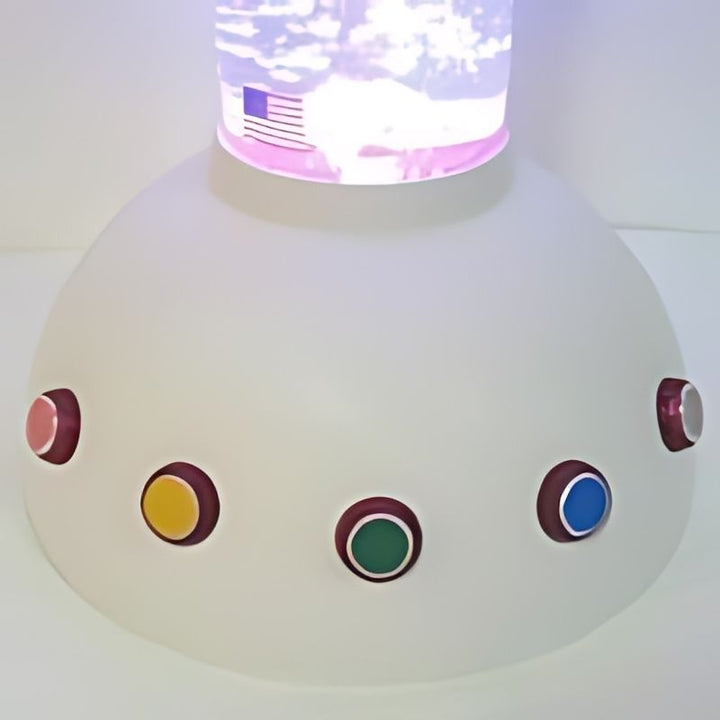 Close-up of the Experia Touch Sensitive LED Sensory Bubble Tube colour buttons on the base showing the four colour-change buttons and the black bubble on/off button requiring minimal pressure