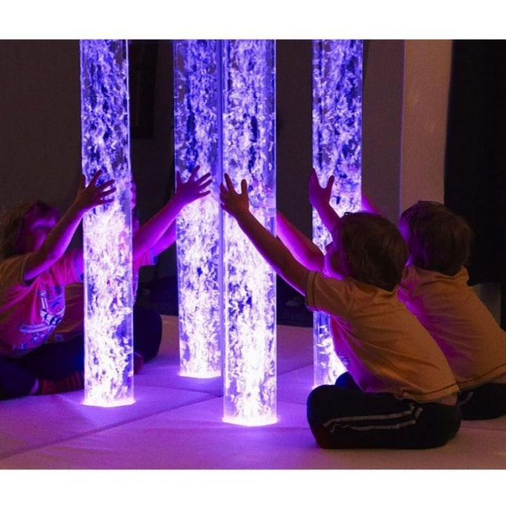 Child actively engaging with the Experia Calming Underwater Adventure Sensory Room, showing hands-on tactile and visual sensory play within the themed multi-sensory bundle