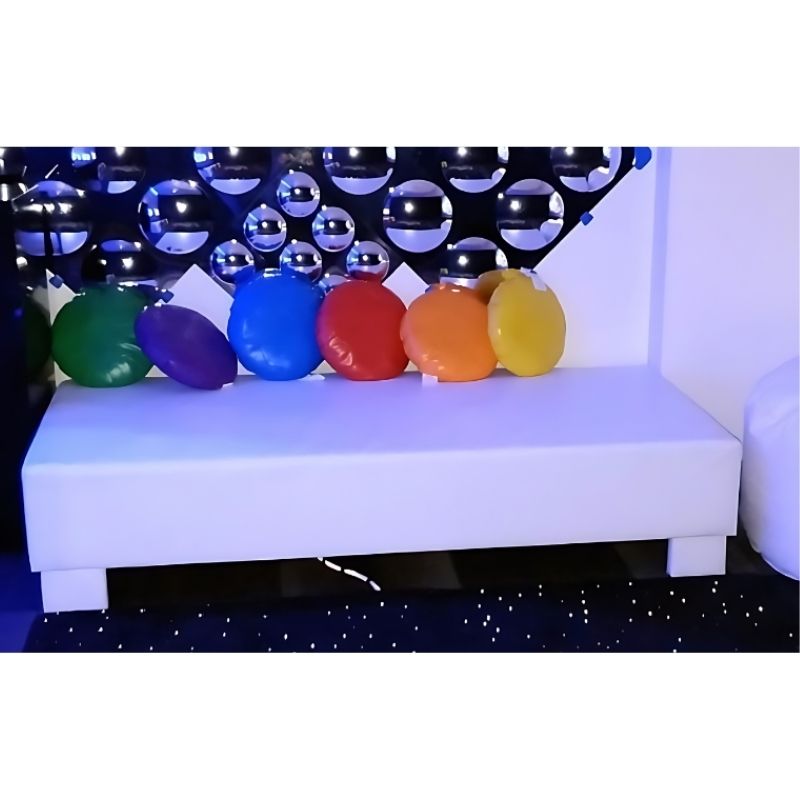 Experia Vibroacoustic Platform landscape view with multicolour pillows showing the wide floor-level vibroacoustic platform suitable for sitting or lying in a sensory room