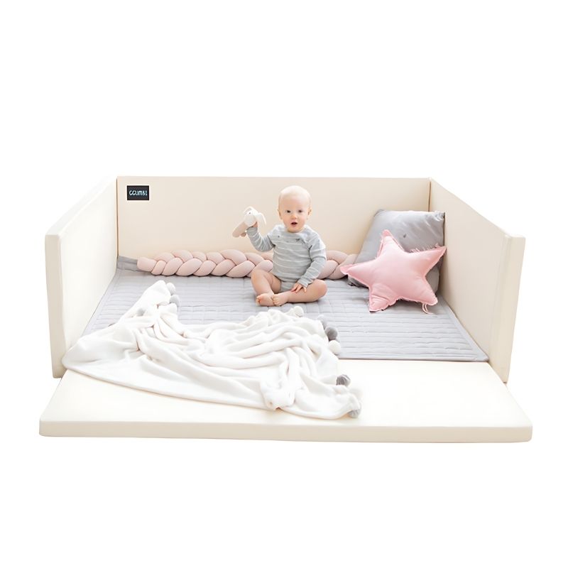 Baby actively playing inside the Ggumbi Lucky Star Clean Bumper Play Room Extra Large Ivory, showing the enclosed bumper play space with 5cm DMF-free foam panels in a landscape home view