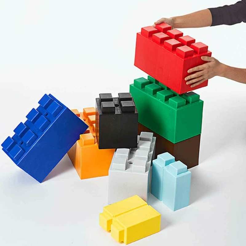 Hands stacking the EverBlock Kids Blocks Play Pack into a tower, showing how these giant building blocks for kids interlock