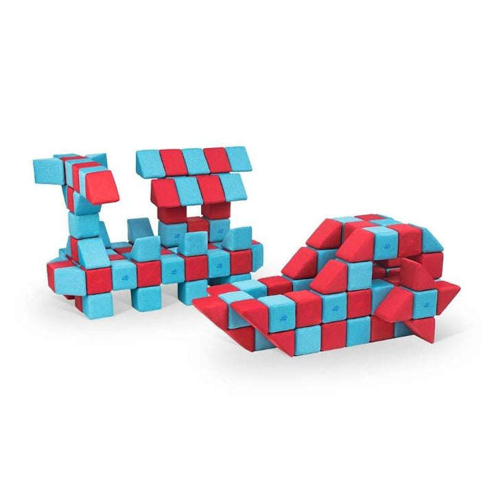 Animal figure alongside a boat shape built from JollyHeap Joy giant magnetic building blocks in blue and red, showing multiple builds side by side