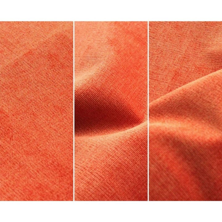 Close-up of Go Coconut - The Coconut in Twisty Tangerine showing the Durable Micro Velveteen micro-brushed fabric texture of the removable machine-washable play couch cover