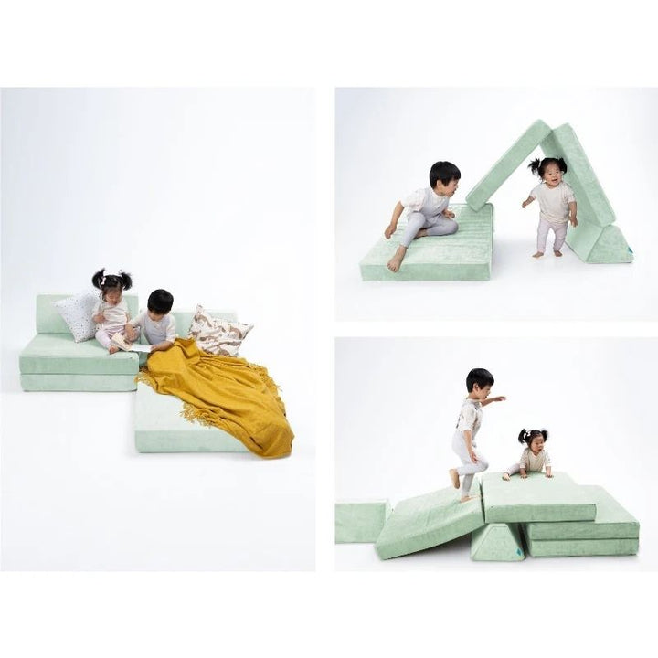 Three children actively playing on Go Coconut - The Coconut modular play couch, showing the open-ended Montessori-inspired foam configuration for creative building, climbing, and sensory play