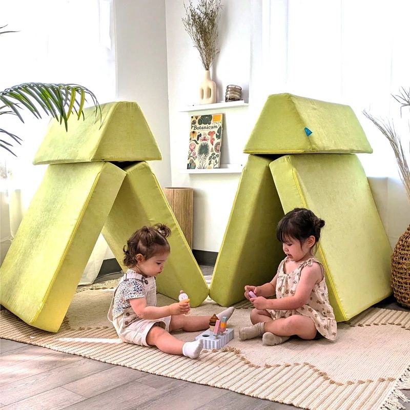 Two children actively playing on Go Coconut - The Coconut in Lima Limon demonstrating the creative modular building and gross motor play value of the Montessori-inspired Canadian-made play couch