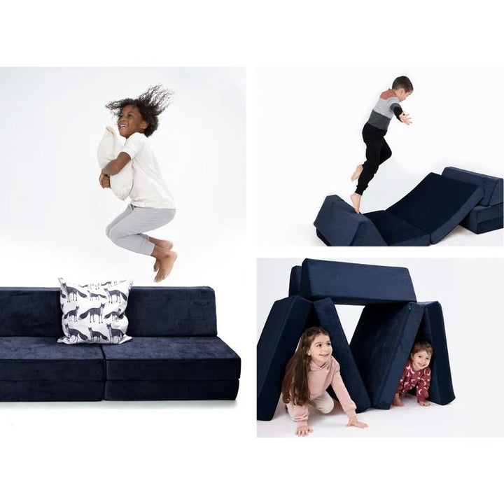 Children building and playing on Go Coconut - The Coconut in Midnight Tide demonstrating the open-ended Montessori-inspired design of the modular Canadian foam play couch