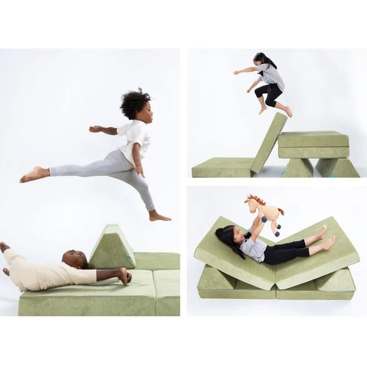 Children playing on Go Coconut - The Coconut in Pale Green demonstrating the creative building and sensory play possibilities of the open-ended Montessori-inspired Canadian-made modular play couch