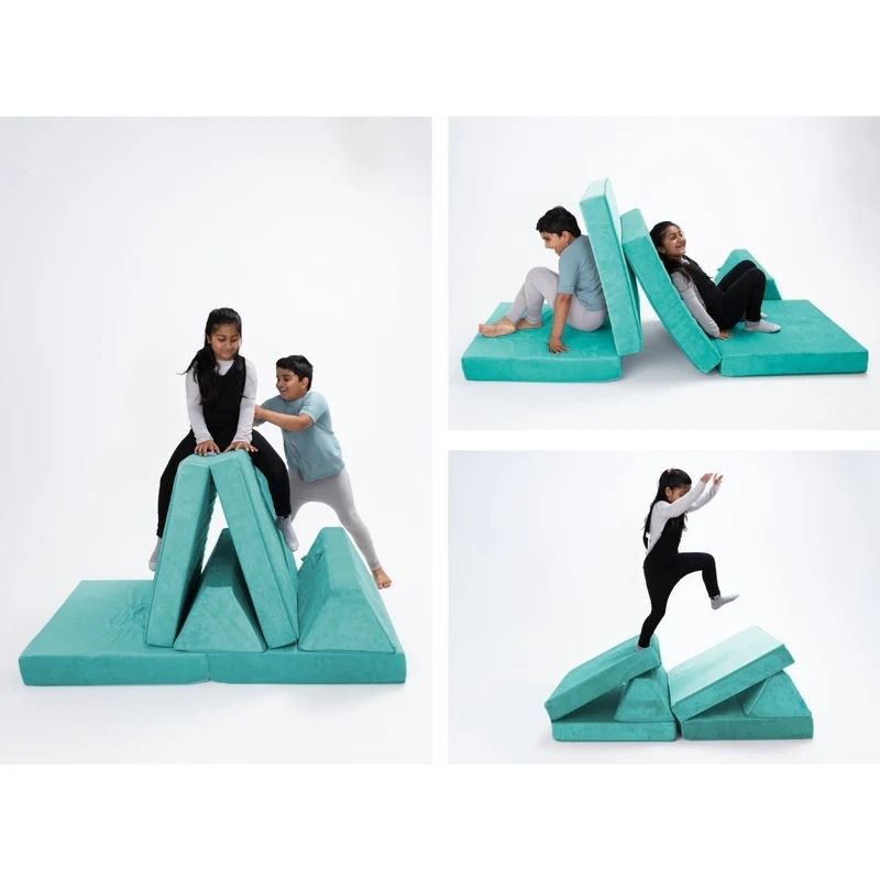 Children playing on Go Coconut - The Coconut modular play couch in Tropical Teal showing the open-ended foam configuration possibilities and creative play value of the Montessori-inspired design