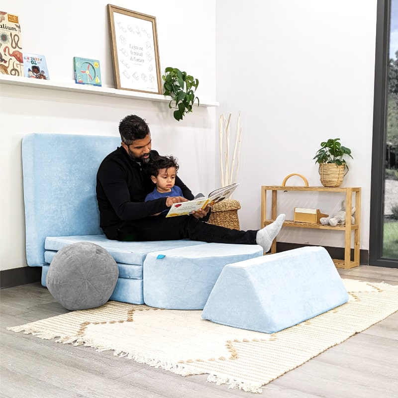 Dad and child playing together on the Go Coconut Half Coconut modular foam play couch, demonstrating family active play and gross motor development