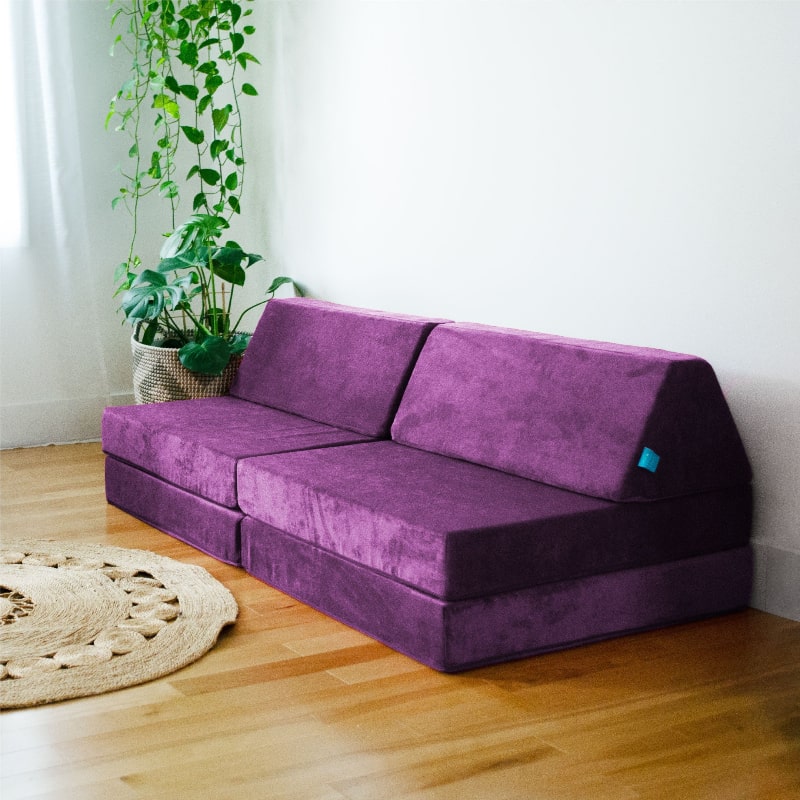 Go Coconut Half Coconut in Groovy Grape styled indoors in a home playroom or sensory space, showing the compact modular footprint