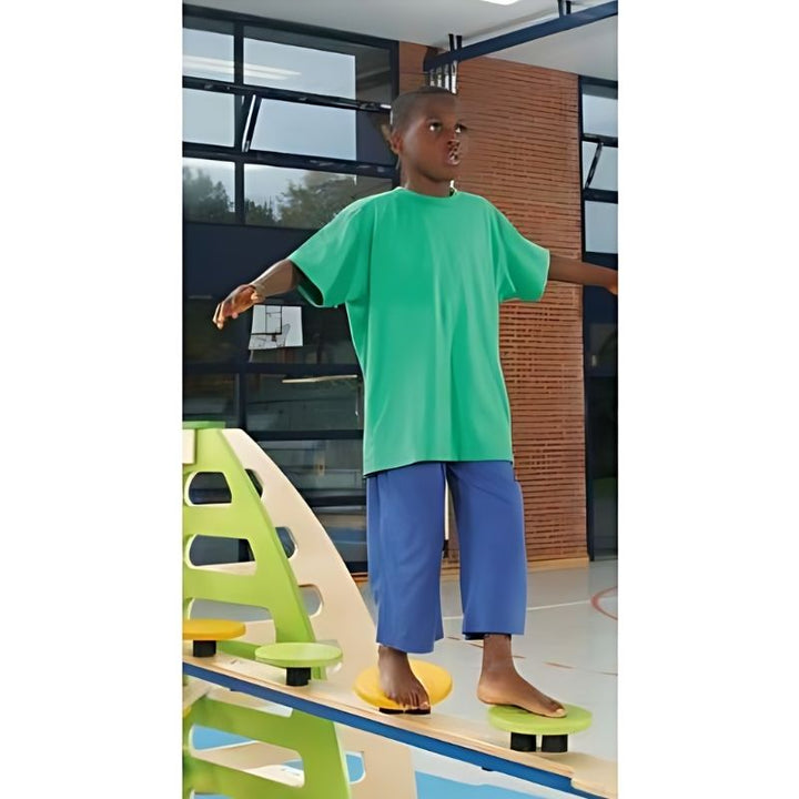 HABA Pro 3 Balancing Board Set in use showing children navigating the birch wood balance path for sensory motor skills development