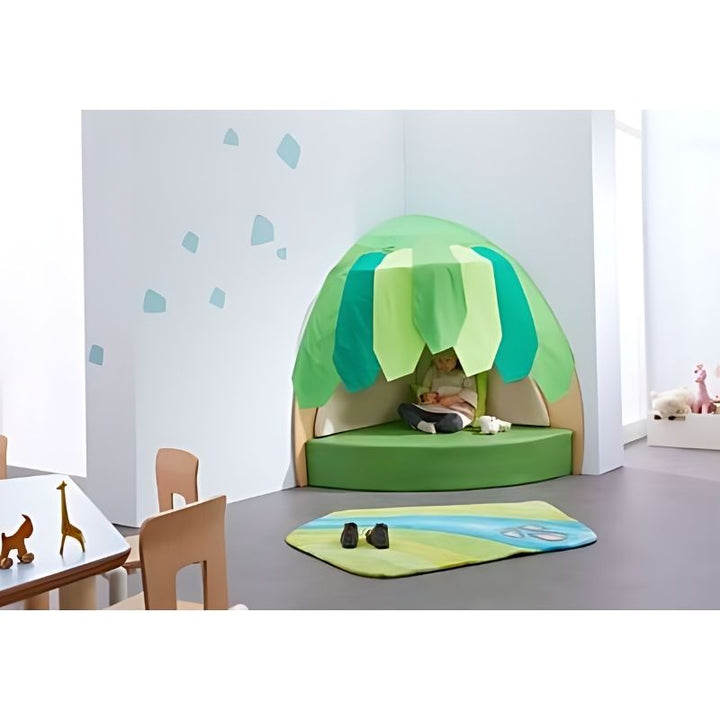 Child engaged in imaginative play inside the HABA Pro Grow.upp Canopy Retreat Cave in an indoor classroom or early learning setting