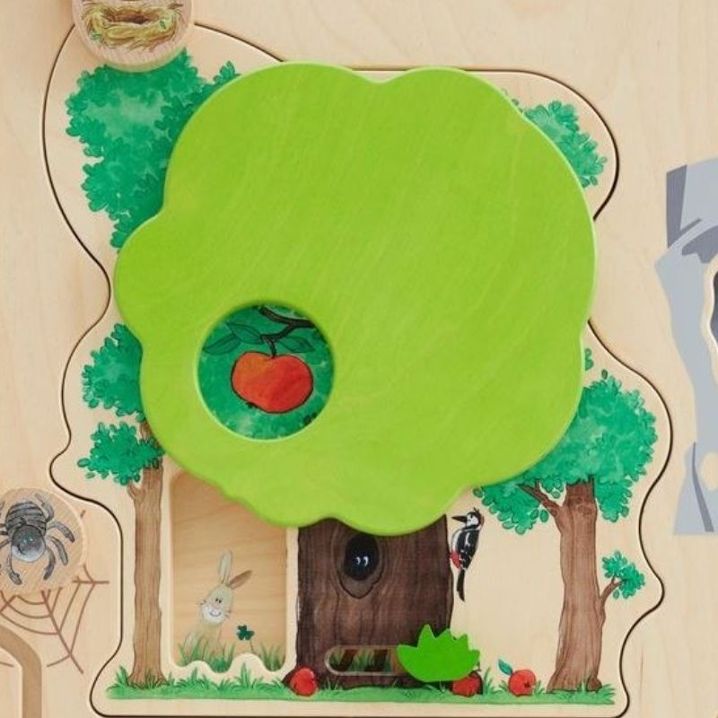 Close-up detail of the apple tree feature on the HABA Pro Forest Sensory Wall Panel, one of the nature-themed tactile discovery elements