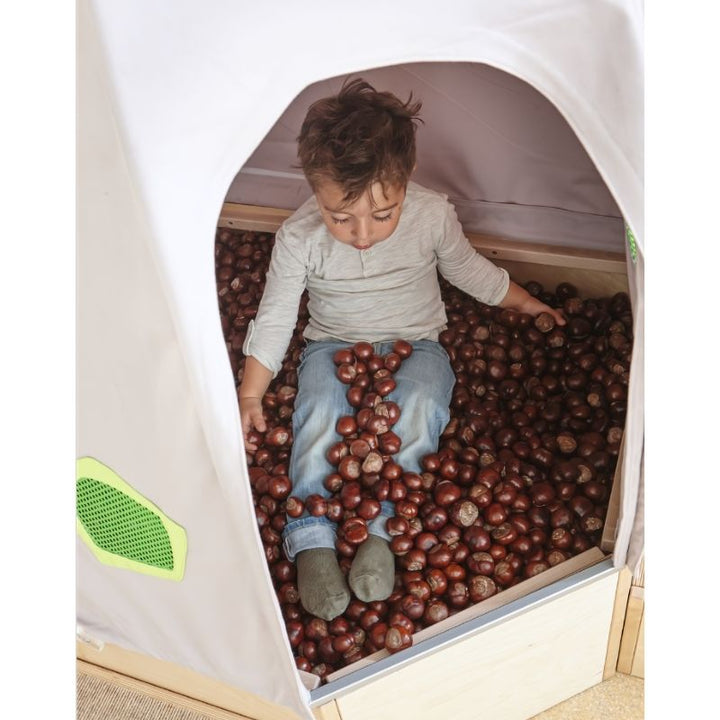 Exterior detail of the HABA Pro Grow.upp fabric cave cover showing soft upholstered material and structural metal frame for sensory room use