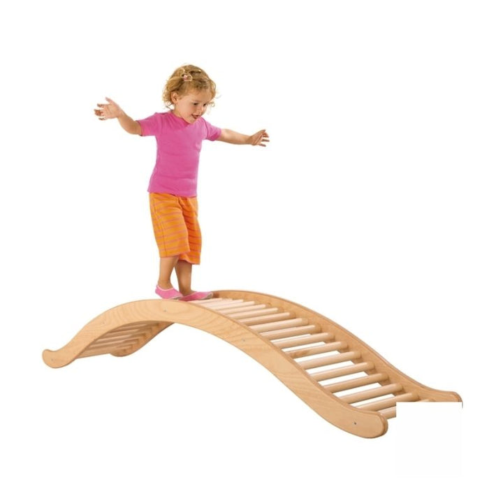 Child walking across the HABA Pro See-Saw Balancing Ladder in bridge configuration, demonstrating balance and coordination development