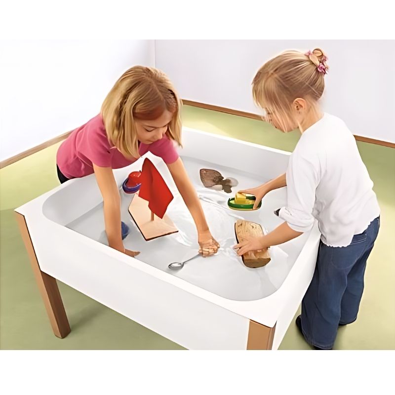 HABA Pro Water & Sand Table with two children engaged in tactile sensory play, showing the deep plastic tub and beech wood base