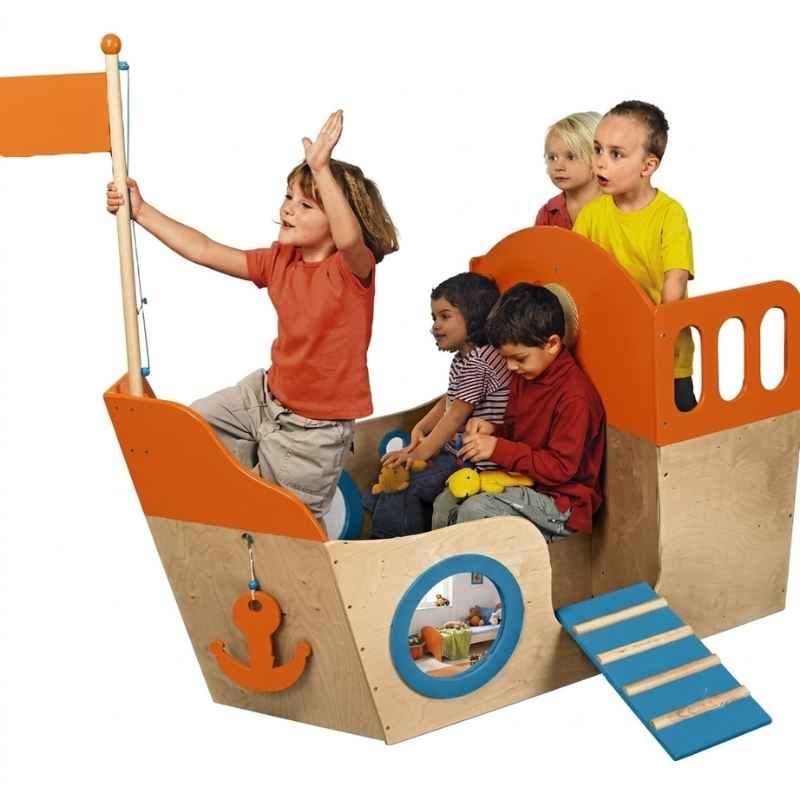 A group of children aboard the HABA Play Sailboat, showing the wooden playhouse's capacity for up to six kids at once