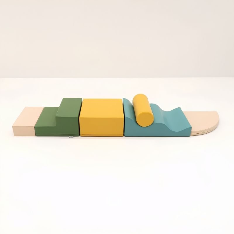 The six individual foam shapes of the IGLU Explorer Soft Play Set in a green, yellow and teal colourway, shown side by side