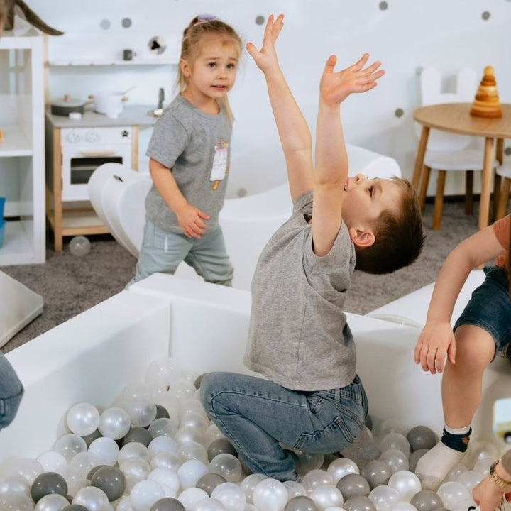 Children playing in the IGLU Soft Play ball pit, part of the Soft Play Party Set foam indoor play equipment set