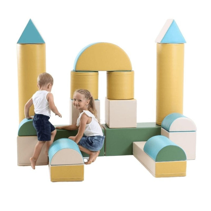 Two children playing with the IGLU Soft Play Fortress Set in pastel turquoise, climbing and building with foam blocks in a home playroom