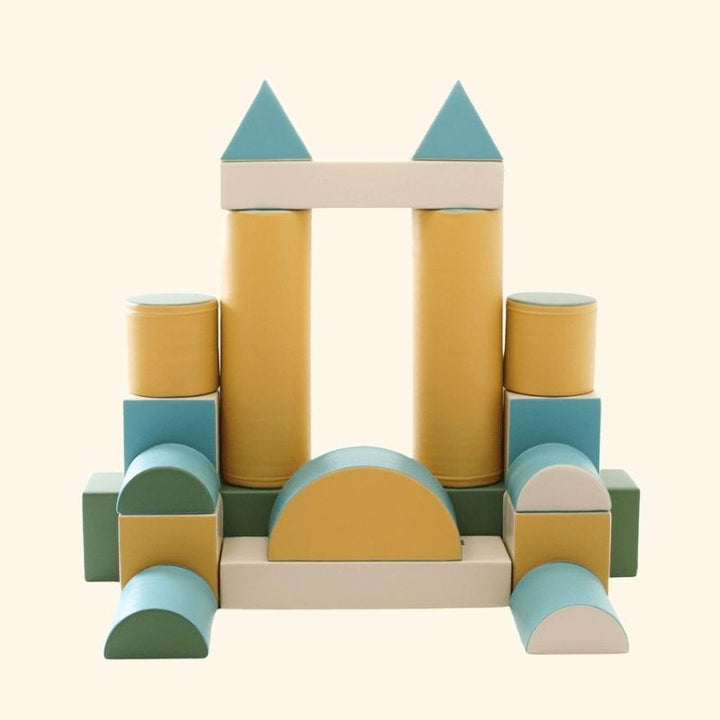 Overview product image of the IGLU Soft Play Fortress foam climbing block set in pastel turquoise showing all included pieces