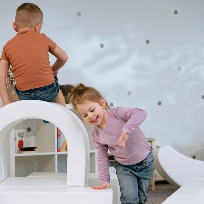 Two children playing together on the IGLU Soft Play Party Set, foam climbing set for cooperative sensory and gross motor play